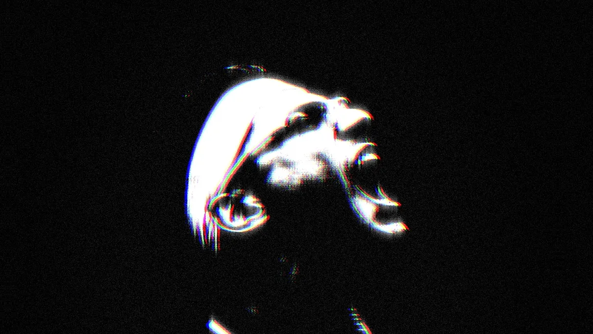 A squash player in the dark, lit from above, looking up, with an RGB colour fringe and film grain